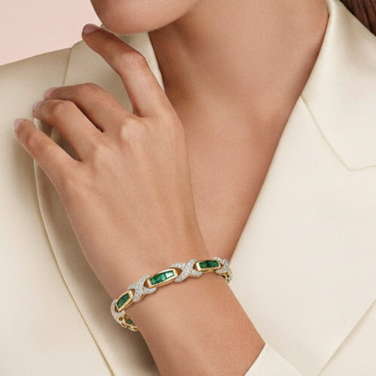 Exquisite 14KT Yellow Gold Emerald and Diamond “X” Motif Bracelet – A Harmony of Color and Brilliance