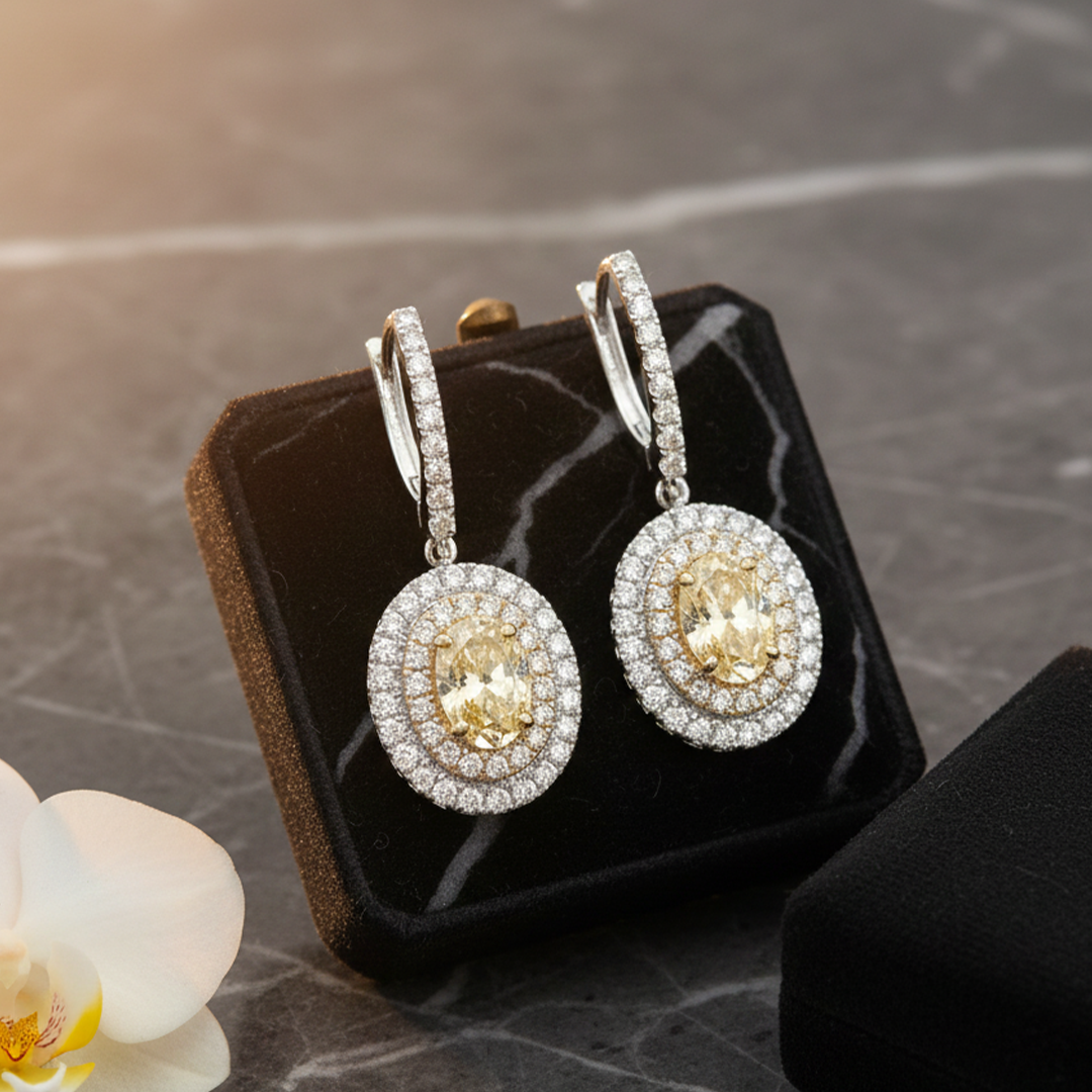 18KT Two-Tone Drop Earrings with GIA Yellow Diamonds (2.02 & 2.04 cts) and Emerald-Cut Diamond Accents