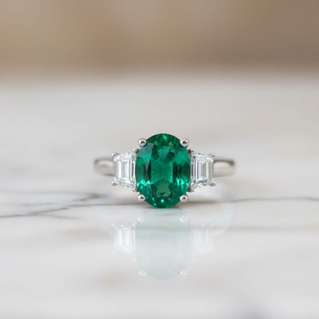 18KT White Gold Oval-Cut Emerald and Trapezoid Diamond Ring