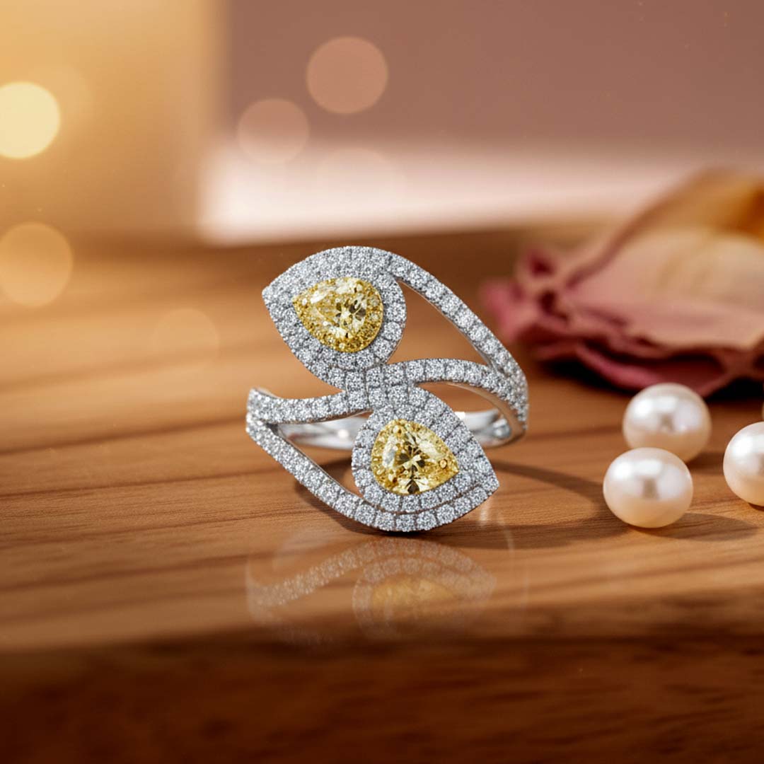 14KT Gold Bypass Ring with 0.75ct Fancy Yellow Pear Diamonds and 0.95cts White Diamonds
