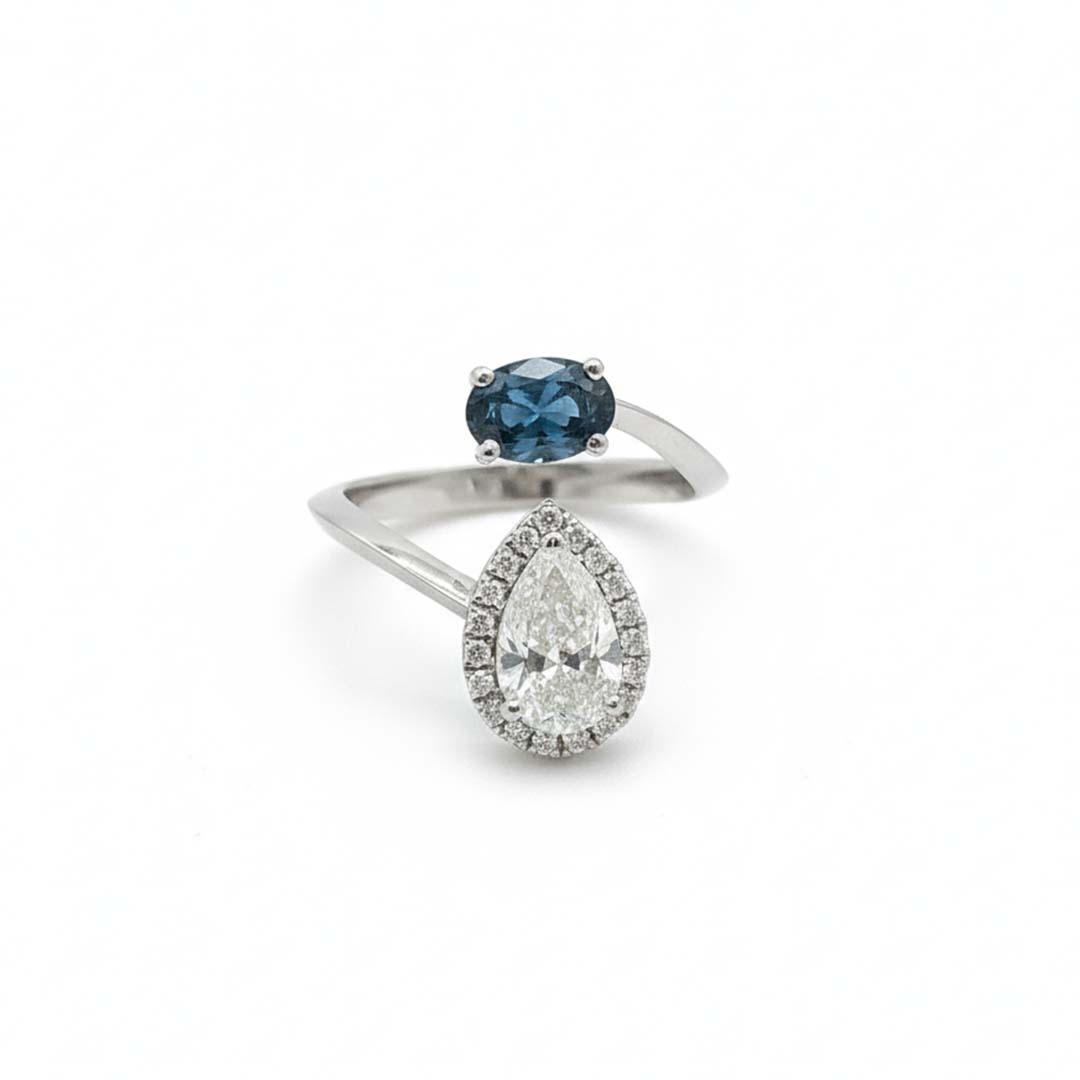 14K White Gold Ladies’ Ring Featuring 0.65ct Natural Blue Diamond and 1.17ct Pear-Cut White Diamond with Halo Accents