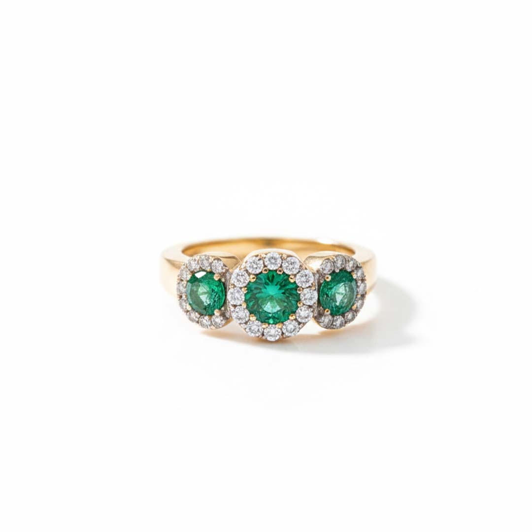 14KT YG Ring with 0.54 CT Total Emeralds and 0.45 CT Total Diamonds – Three-Stone Halo Design