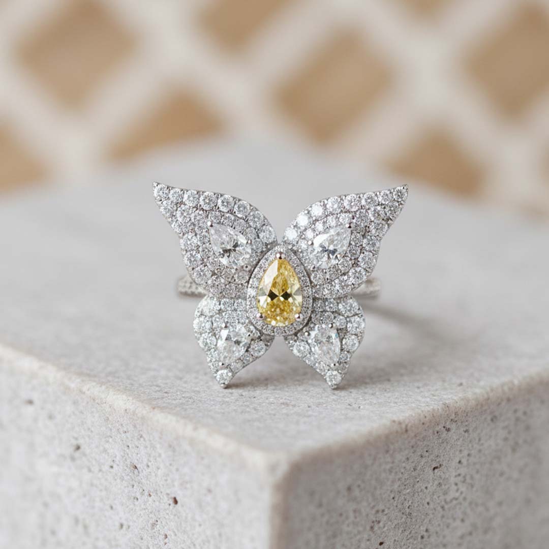 18KT Gold Butterfly Ring with 0.85ct Fancy Yellow Center Diamond and 2.60cts Side Diamonds