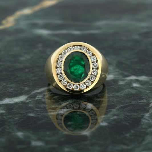 14KT Yellow Gold Men’s Ring Featuring 6.10ct Vivid Oval Emerald Surrounded by 1.13ct Diamonds